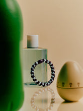 Laden Sie das Bild in den Galerie-Viewer, Haargummi Seablue dark purple glitter Stripe